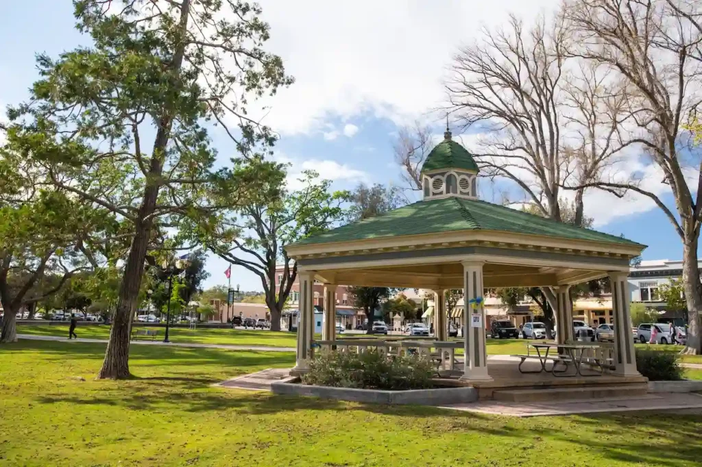 Downtown Paso Robles City Park with gazebo, green space, and surrounding local businesses in California.